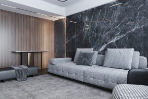 sala de estar com parede marmorizada preta.